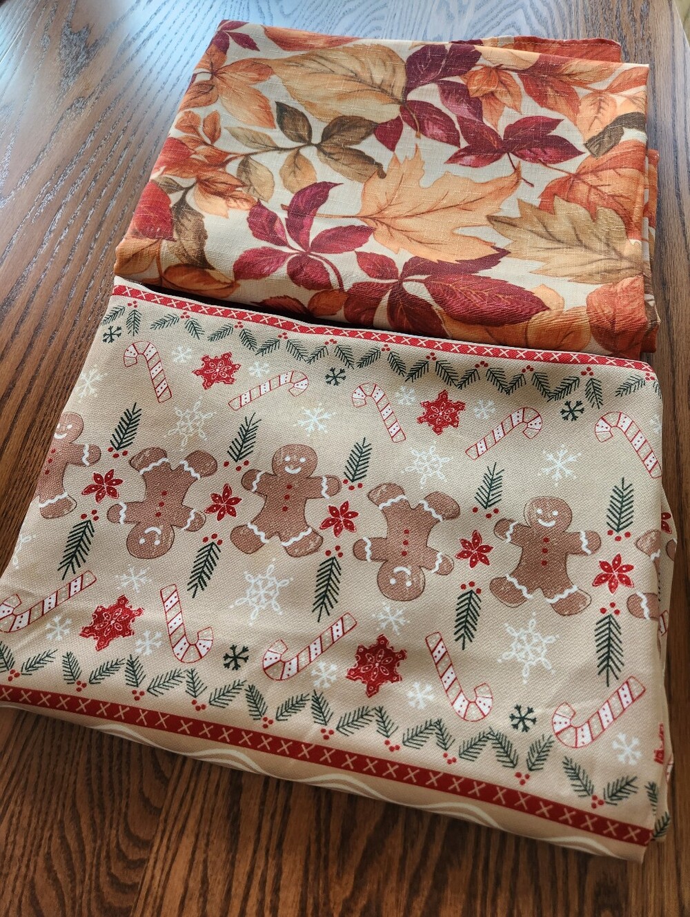 Two Oval 60 X 84 Tablecloths